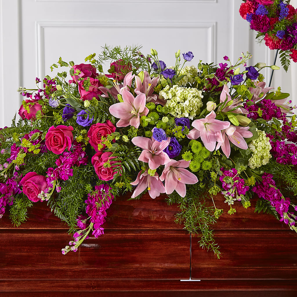 Radiant Tribute Casket Spray – Tinys Flowers, Lansing IL